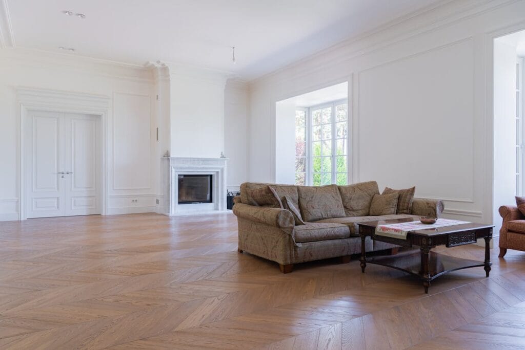 Beautiful living room with elegant hardwood flooring that increases home value in Spring TX