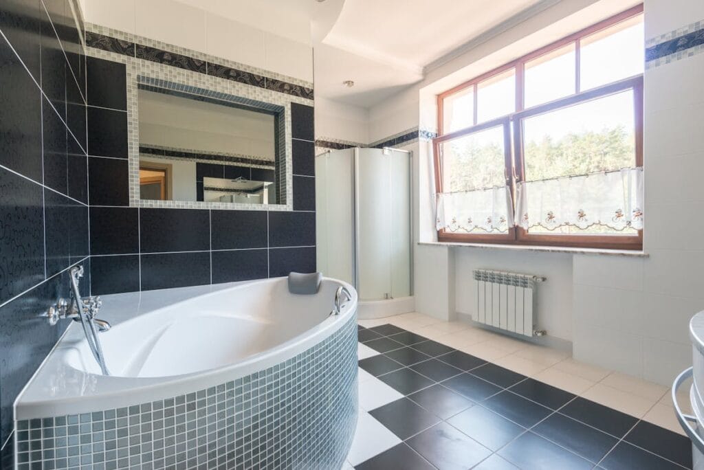 Modern bathroom with tile flooring renovation in Spring TX home